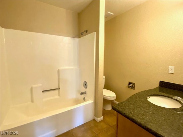 full bathroom with washtub / shower combination, tile patterned floors, toilet, and vanity