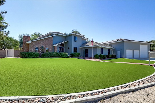 view of front facade with a garage and a front yard