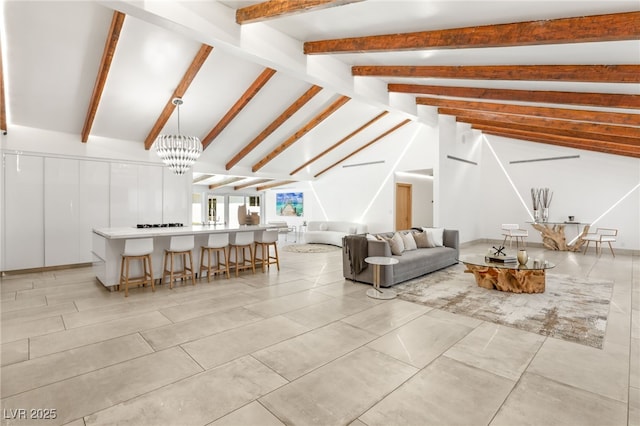 unfurnished living room featuring a notable chandelier and vaulted ceiling with beams