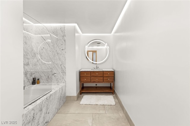 bathroom with tiled shower / bath, vanity, and tile patterned flooring