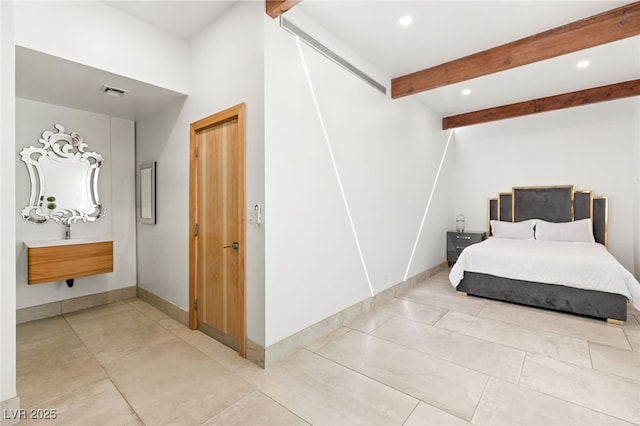 tiled bedroom featuring beam ceiling