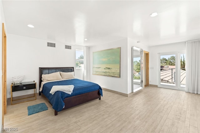 bedroom featuring access to exterior and light hardwood / wood-style flooring