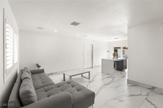 living room featuring a textured ceiling