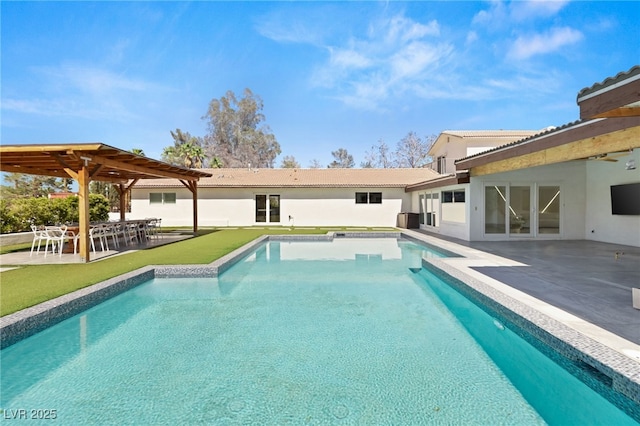 view of swimming pool featuring a patio and central AC