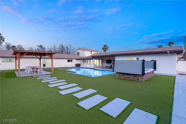 view of pool featuring a patio, a yard, and a gazebo