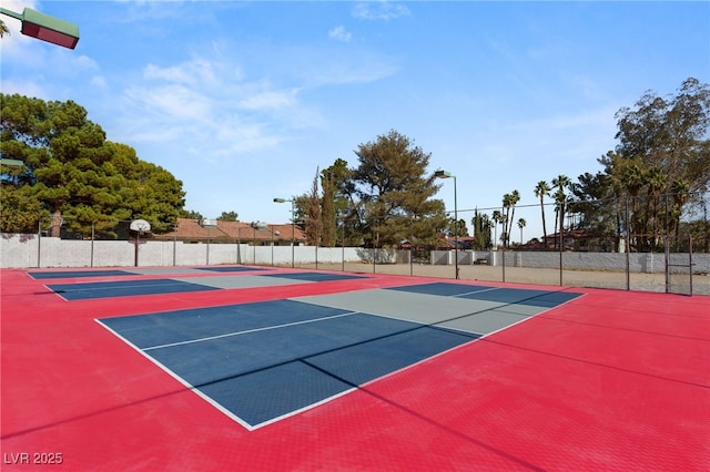 view of sport court with basketball hoop