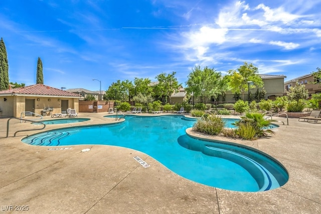 pool with a patio area