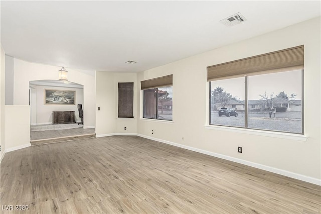 unfurnished living room with wood-type flooring