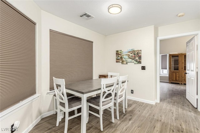 dining room with light hardwood / wood-style flooring