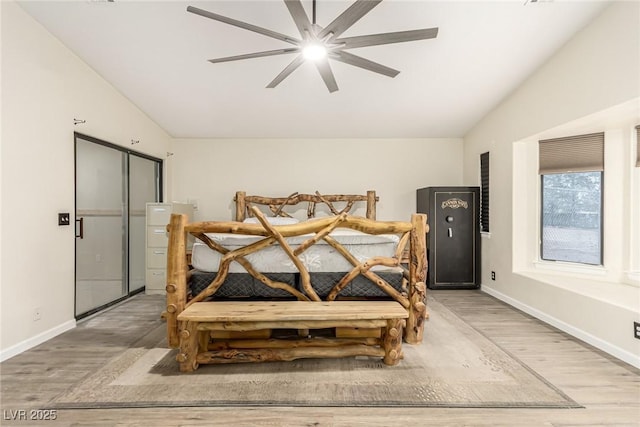 bedroom with ceiling fan and light wood-type flooring