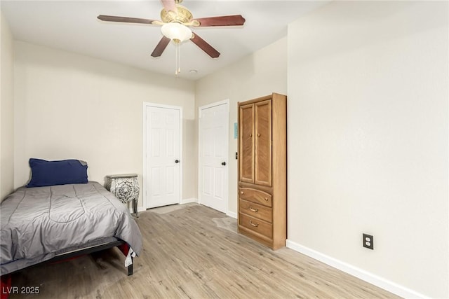 bedroom with light wood-type flooring and ceiling fan