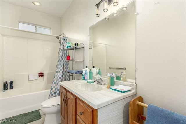 full bathroom featuring shower / tub combo, vanity, and toilet