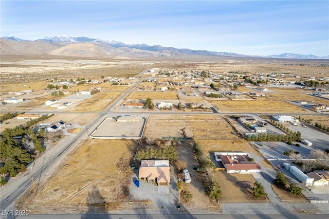 birds eye view of property featuring a mountain view