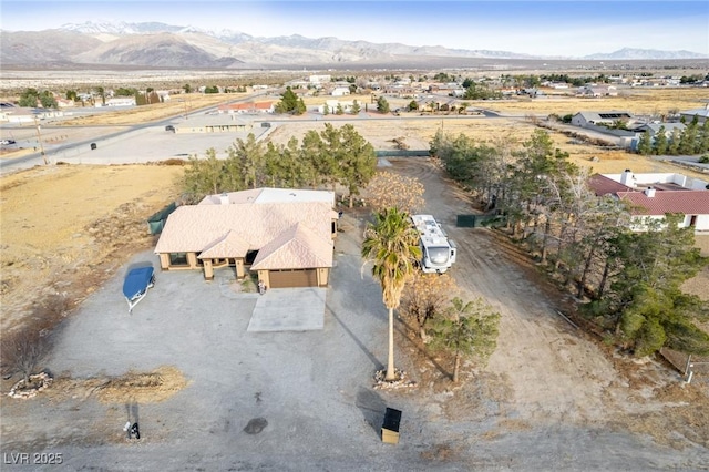 birds eye view of property featuring a mountain view