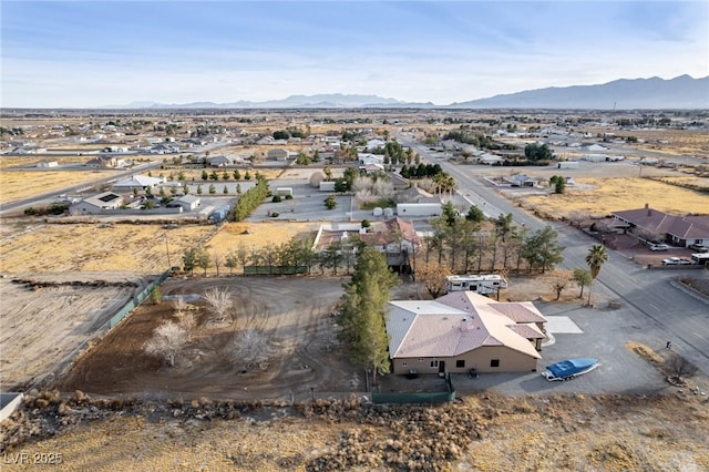 birds eye view of property with a mountain view