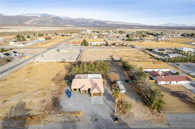 drone / aerial view featuring a mountain view