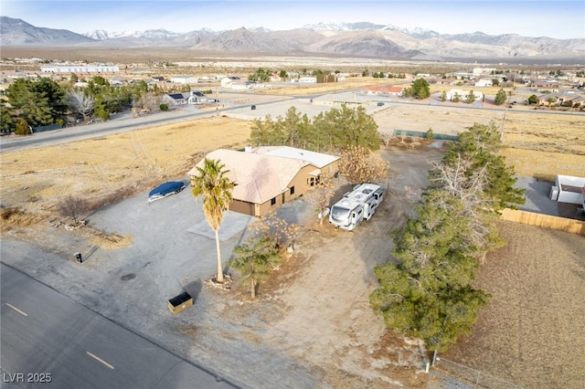 drone / aerial view featuring a mountain view