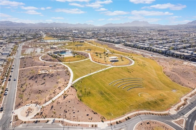 birds eye view of property with a mountain view