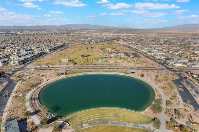 bird's eye view with a water and mountain view