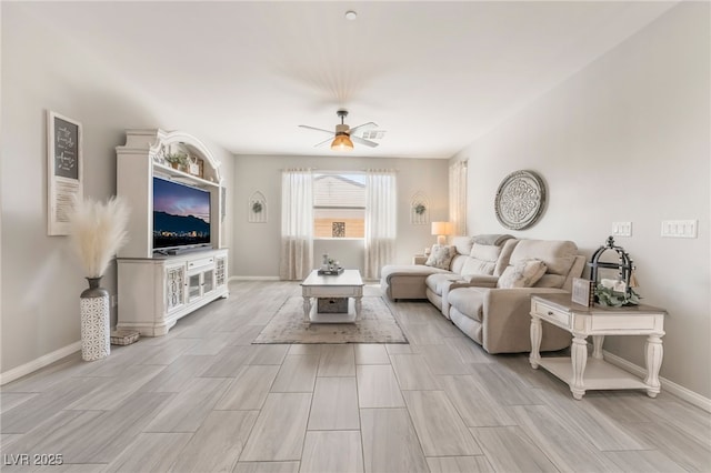 living room featuring ceiling fan