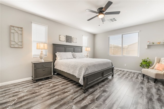 bedroom with ceiling fan and dark hardwood / wood-style flooring