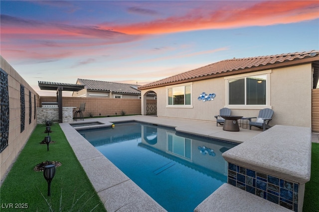 pool at dusk with a yard, a pergola, and a patio