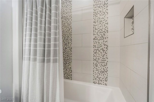 bathroom with shower / bathtub combination with curtain