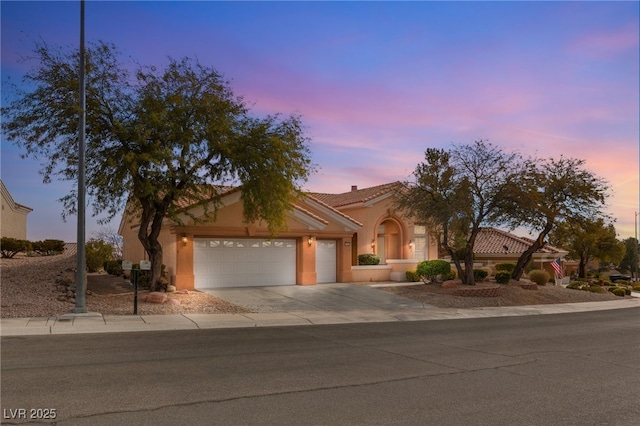 view of front of property with a garage