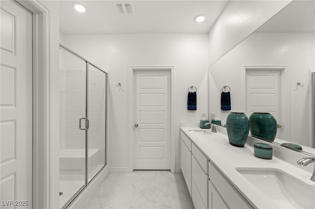 bathroom featuring vanity and walk in shower