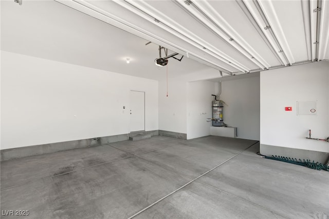 garage featuring a garage door opener and water heater