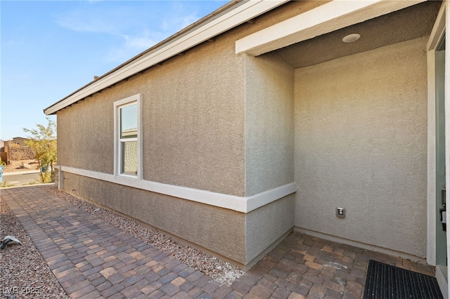 view of property exterior with a patio