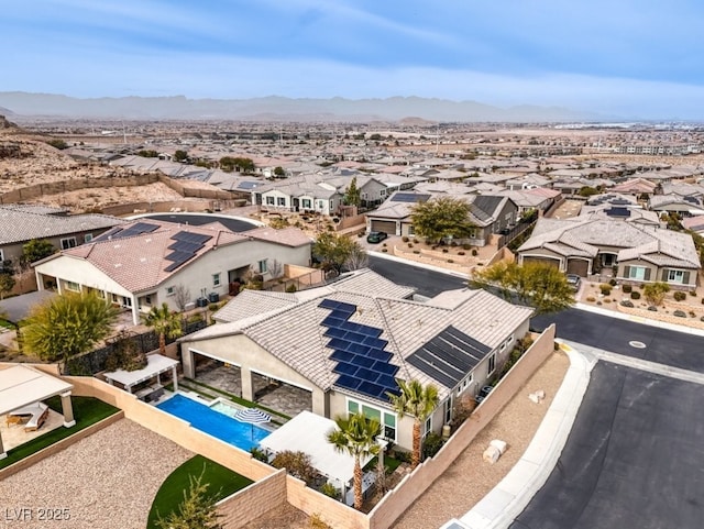 drone / aerial view with a residential view and a mountain view