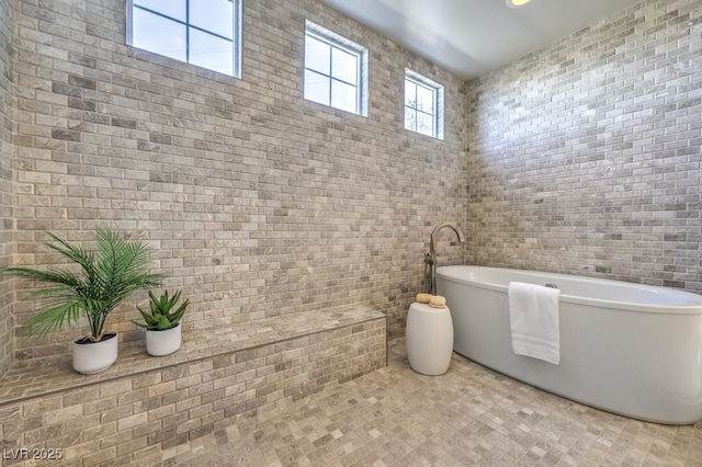 full bathroom featuring a freestanding bath