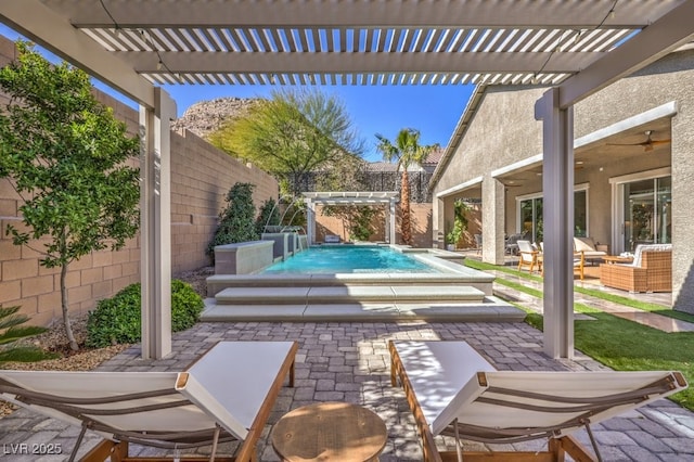 view of patio / terrace with a fenced backyard, outdoor lounge area, a ceiling fan, a pergola, and a swimming pool