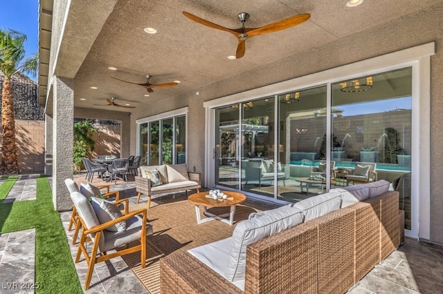 view of patio / terrace featuring outdoor dining area, ceiling fan, fence, and outdoor lounge area