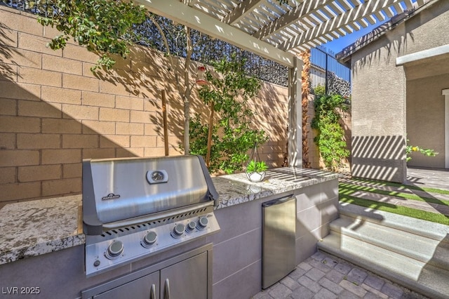 view of patio with a grill, area for grilling, a pergola, and a fenced backyard