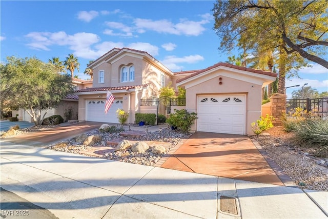 mediterranean / spanish home with a garage