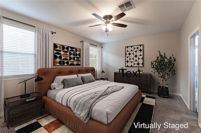 bedroom with ceiling fan and carpet flooring