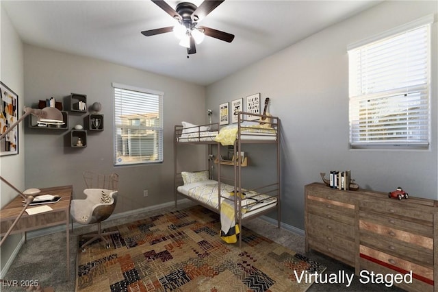 bedroom featuring multiple windows and ceiling fan