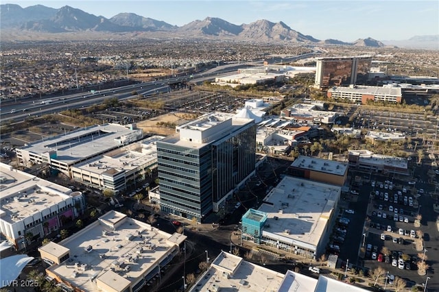 birds eye view of property with a mountain view