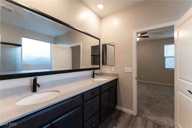 bathroom with vanity, wood-type flooring, and ceiling fan