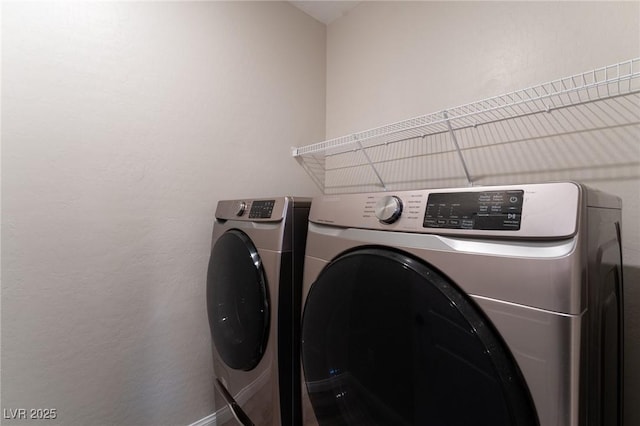 laundry room with independent washer and dryer