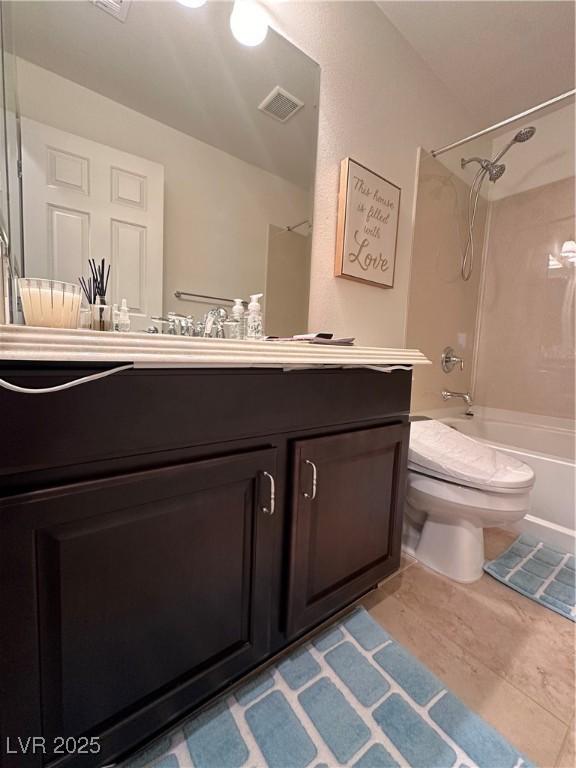 full bathroom with washtub / shower combination, vanity, toilet, and tile patterned flooring