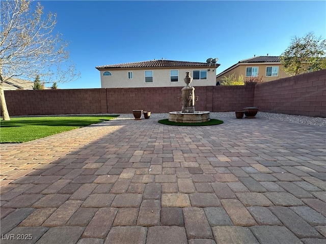 back of property featuring a patio area