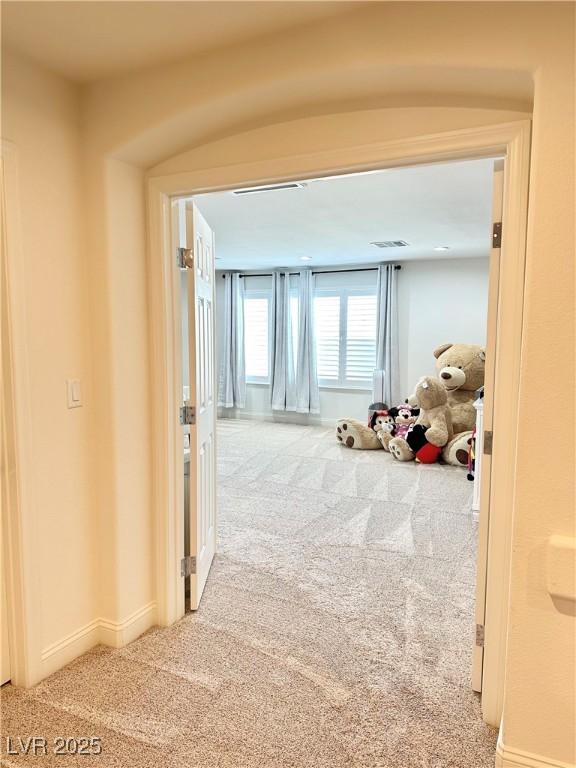 corridor with carpet floors