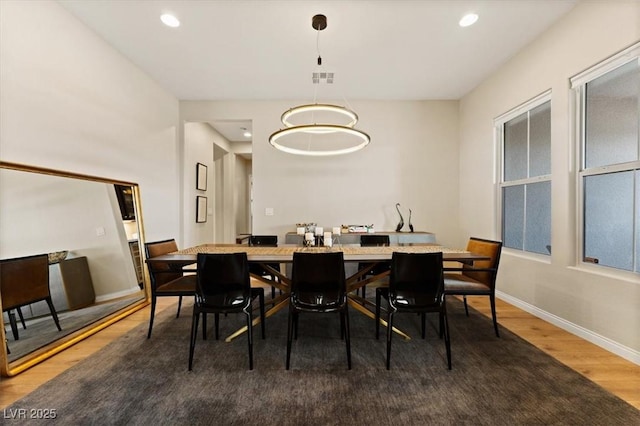 dining space featuring dark hardwood / wood-style flooring