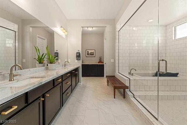 bathroom featuring vanity and shower with separate bathtub