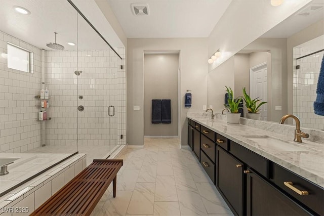 bathroom with vanity and an enclosed shower