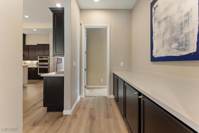 corridor featuring light hardwood / wood-style floors