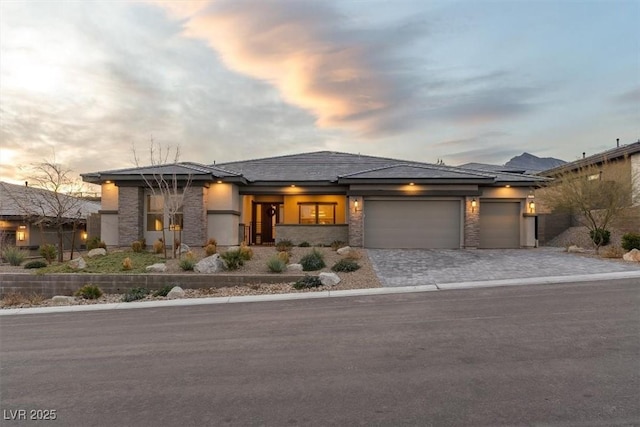 prairie-style house featuring a garage